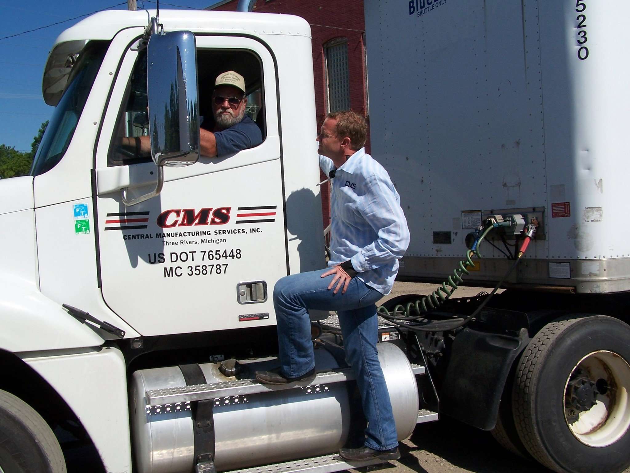 Jamie Clark and one of the first CMS trucks.